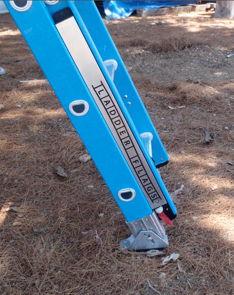 'OSHA' Compliant Ladder On Job Site with retracted ladder flag